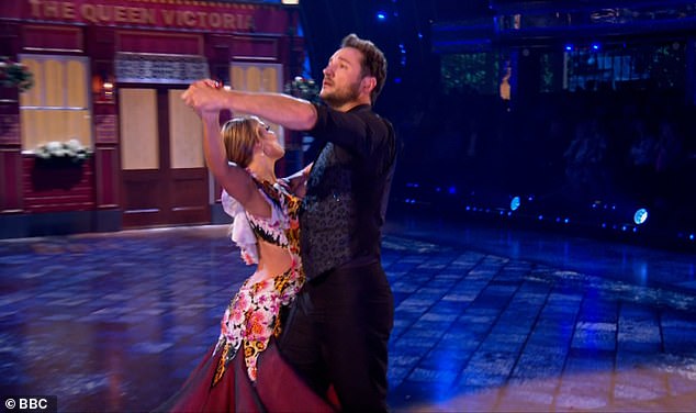 Giving his all: They danced outside a recreated The Queen Vic pub, where his character Martin frequents on a regular basis