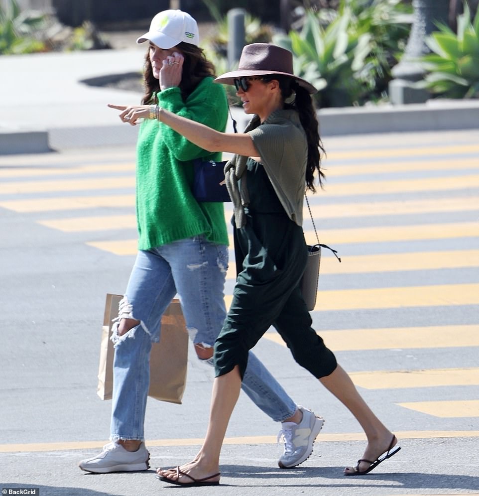 Pictured: Meghan out shopping with her friend as criticism poured in about her comments of the show