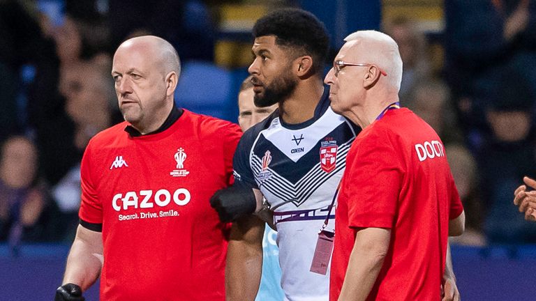 Kallum Watkins is helped from the field after suffering a head injury