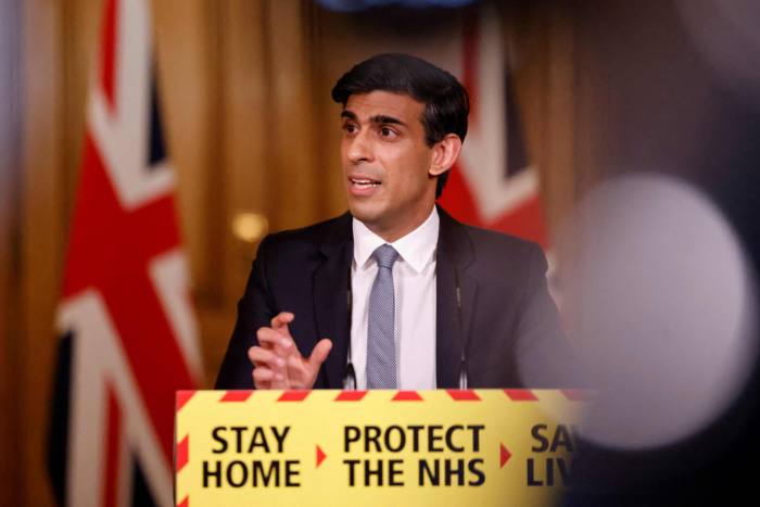 Rishi Sunak addressing the media as chancellor in March last year