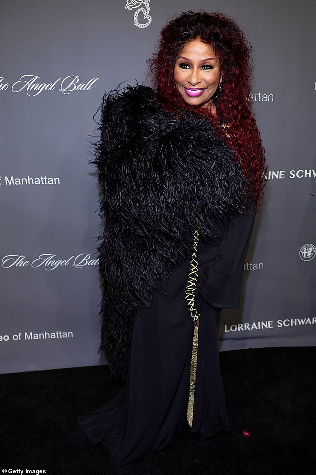 Theatrical! Legendary singer Chaka Khan, 69, dazzled in a black outfit with an opulent feather shawl, and wore her auburn hair in voluminous tight curls