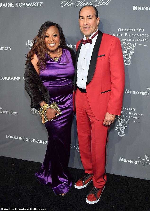 Violet vision: TV personality Star Jones, 60, and husband Ricardo Lugo opted for bright looks, with Star looking fabulous in a rich purple silk gown and black fur cape