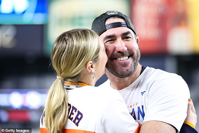 Special moment: The two lovebirds were in high spirits as the couple took a moment to celebrate Justin's win on Sunday night