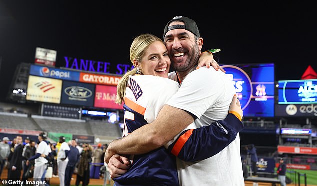 Big night: Kate supported her husband by cheering him on from the stands and also donned a sports jacket with Justin's name printed on the fabric