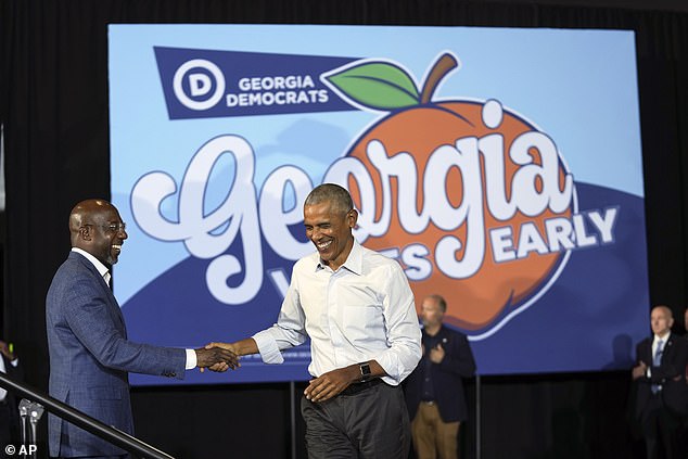 Former President Barack Obama (right) shakes hands with Sen. Raphael Warnock (left). Both Democrats mocked Republican Senate hopeful Herschel Walker