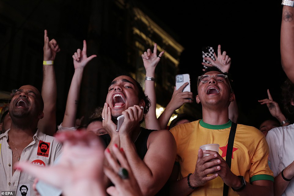 Supporters of the Brazilian presidential candidate Luiz Inacio Lula da Silva celebrate the results of the second round of presidential elections, in Rio de Janeiro, Brazil