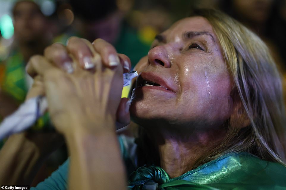 Supporters of candidate Jair Bolsonaro of Liberal Party gather on presidential runoff day on October 30, 2022 in Rio de Janeiro, Brazil