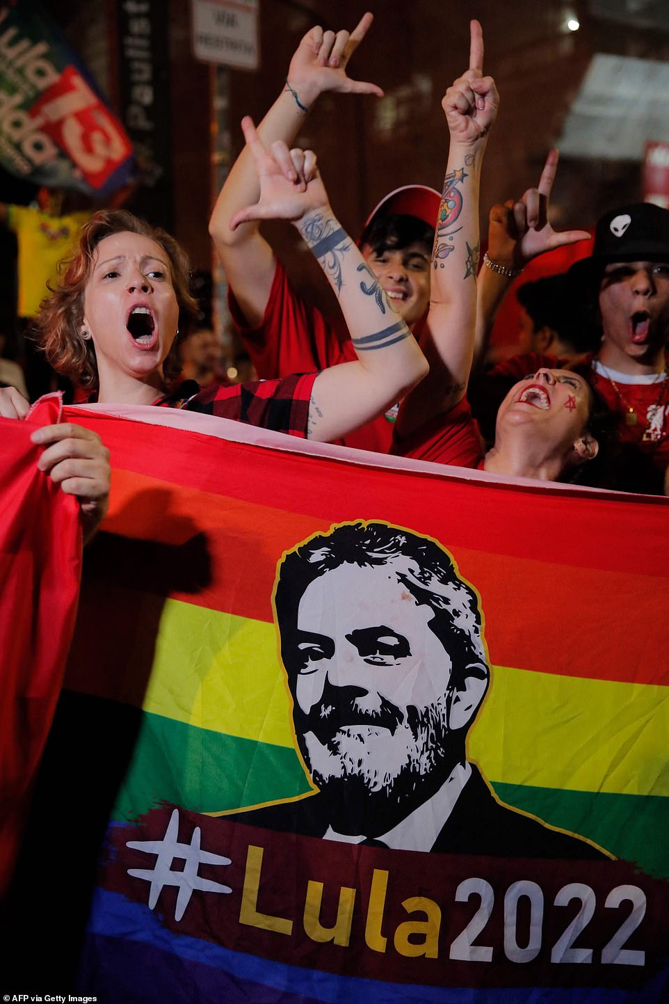 Supporters of Luiz Inacio Lula da Silva celebrate while watching the vote count of the presidential run-off election at the Paulista avenue in Sao Paulo, Brazil