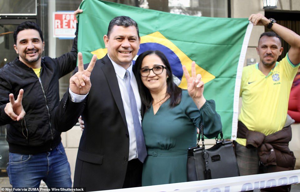 Brazilians smile in New York as they vote in Runoff Elections to elect from one of the two Presidential candidates