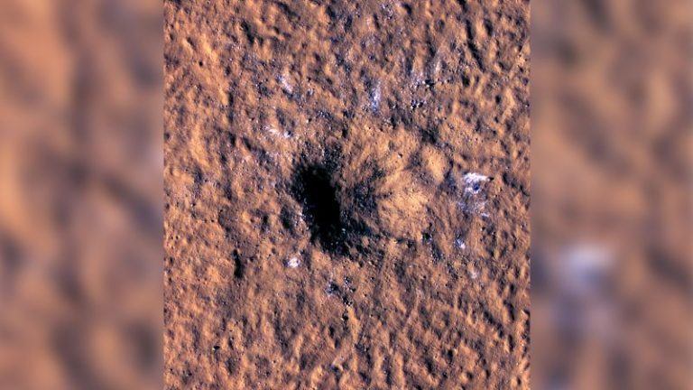 Space rock slams into Mars and reveals buried ice