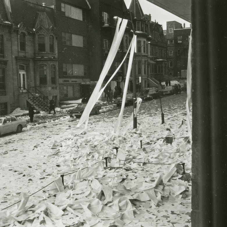 black and white photo of street deeply covered in white paper