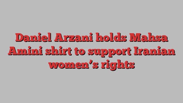 Daniel Arzani holds Mahsa Amini shirt to support Iranian women’s rights