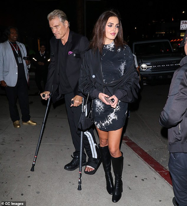 Dolph Lundgren arrives on crutches for a dinner date with fianceé Emma Krokdal in LA