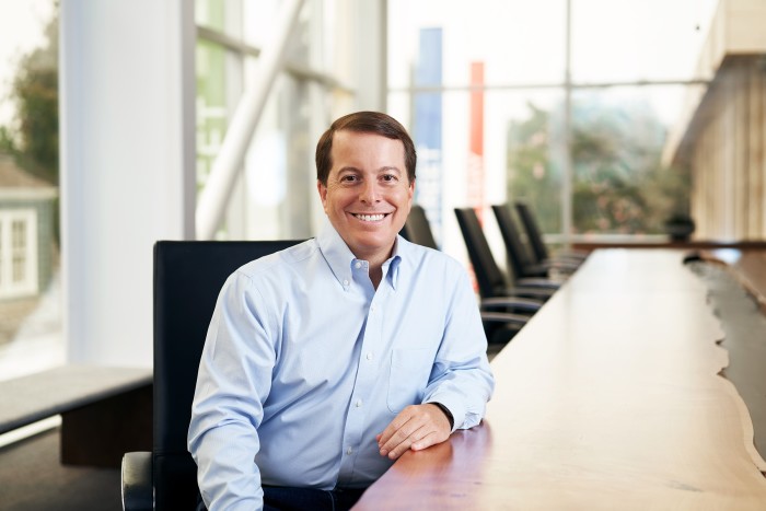 Jamie Iannone, the chief executive of eBay, sits in a boardroom