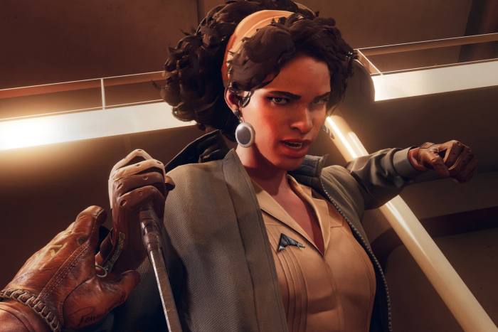 An image from a video game shows a black woman wielding a long knife