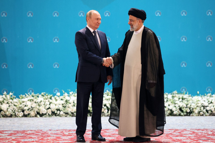 Iran’s president Ebrahim Raisi greets his Russian counterpart Vladimir Putin in Tehran in July