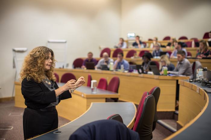 A lady teaching at Cranfield School of Management