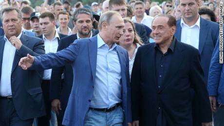 Russian President Vladimir Putin (center left) and former Italian Prime Minister Silvio Berlusconi on September 11, 2015 in Crimea. 