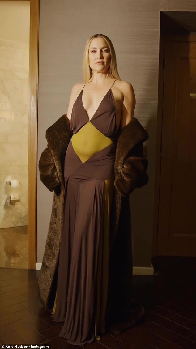 Kate Hudson shows off tanned skin in low-cut brown and gold dress while posing in photo shoot