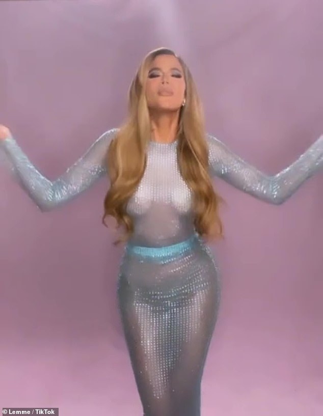 Khloe Kardashian shows off her figure in see-through dress while teasing collaboration with Kourtney