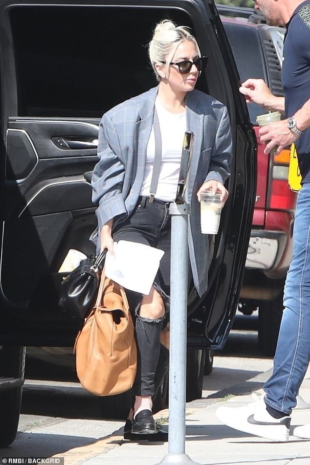 Lady Gaga nails the business casual look in blazer and ripped jeans