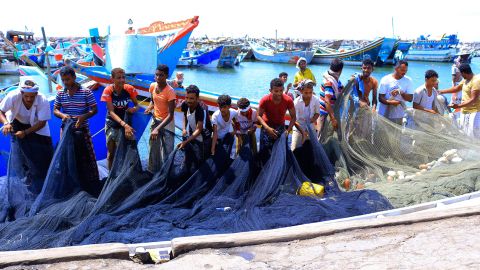 Yemeni fishermen dock their boats at the embattled Red Sea port city of Hodeida on Thursday.  