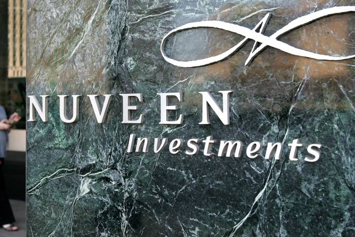 The Nuveen investments logo on green marble