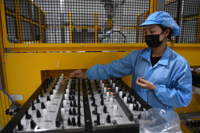 A worker assembles an electric car battery at the electric automobile plant of VinFast in Haiphong, Vietnam, in April