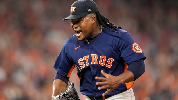 Astros burst ahead in 1st inning against Phillies, hold on to even World Series