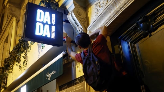 Parkour athletes switch off Paris lights one by one