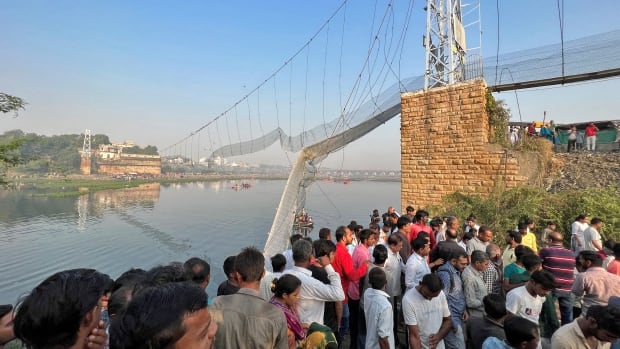 Death toll in India rises to more than 130 in suspension bridge collapse