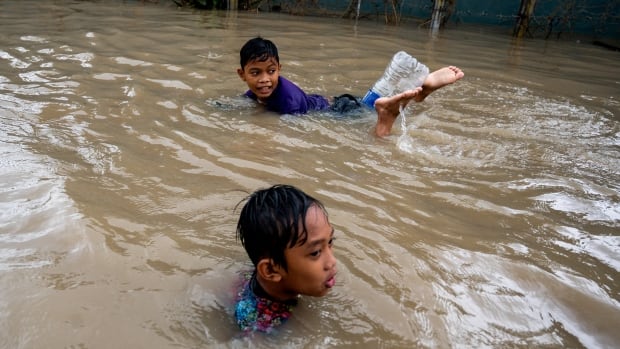 More than 100 people dead after tropical storm hits Philippines