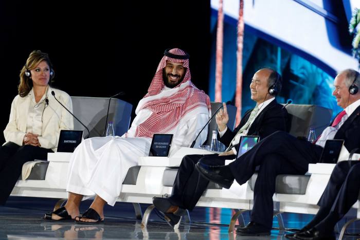 Saudi Crown Prince Mohammed bin Salman on stage with others at a conference in Riyadh in 2017