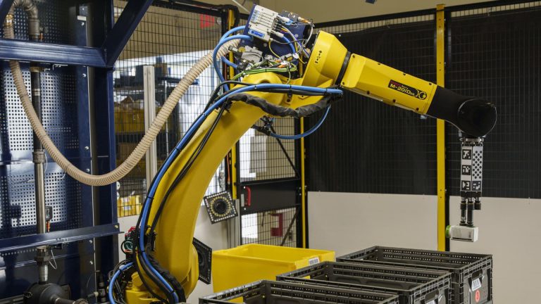 Amazon introduces robotic arm that can do repetitive warehouse tasks