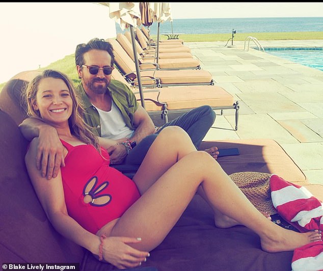 Happy couple: Lively stood in a tight red one-piece bathing suit in a couple of the photos and snuggled up next to her 46-year-old husband while lying back on a beach chair