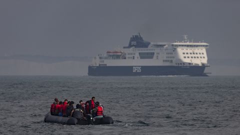 An inflatable craft carries migrants across the English Channel.