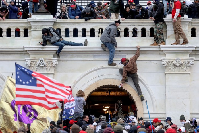 Donald Trump supporters storm the US Capitol in January 2021. Many senior Republican  lawmakers have downplayed Trump’s role in the attack