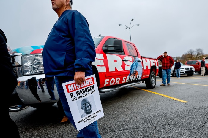 Herschel Walker supporters gather at a campaign event in Ringgold, Georgia. Walker, a former American football star and self-professed ‘warrior for God’, has faced allegations of domestic violence