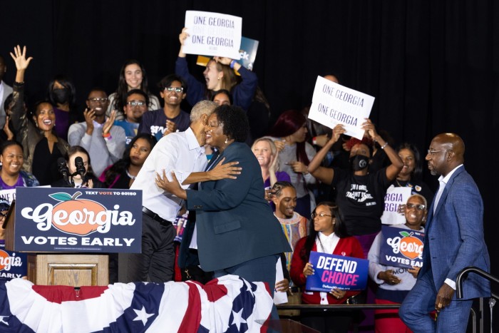 Former president Barack Obama hugs Georgia gubernatorial candidate Stacey Abrams, who has brushed off concerns that energy among Democrats would be subdued this year