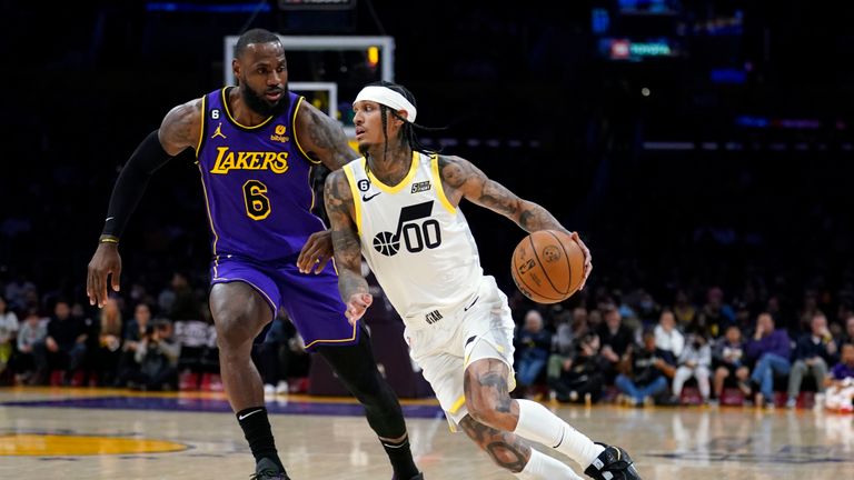 Utah Jazz guard Jordan Clarkson (00) dribbles past Los Angeles Lakers forward LeBron James (6) during the first half of an NBA basketball game Friday, Nov. 4, 2022, in Los Angeles. (AP Photo/Marcio Jose Sanchez)


