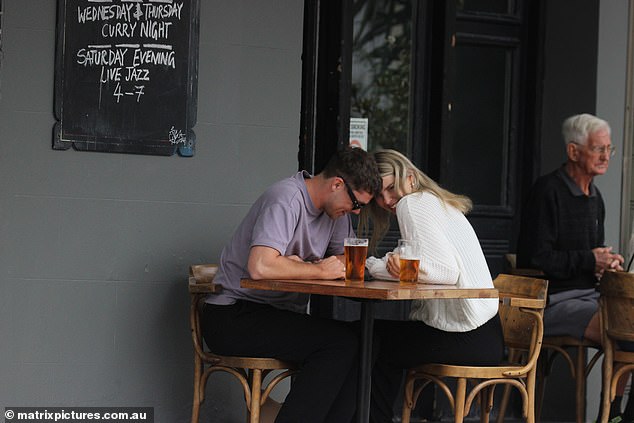 The couple embraced one another and shared a smooch as they enjoyed a glass of beer at The Eveleigh Hotel