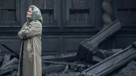 Imelda Staunton as Queen Elizabeth II surveys the damage of a devastating fire in 