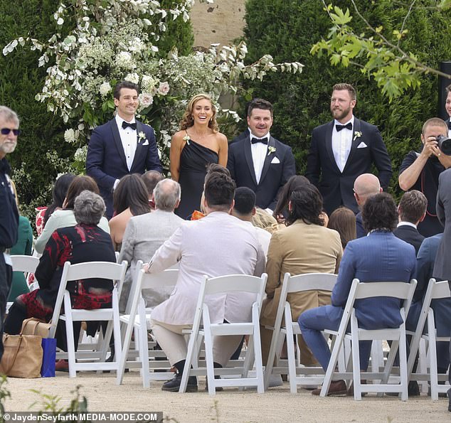 Matty and Kate couldn't wipe the smiles off their faces as Laura made her entrance