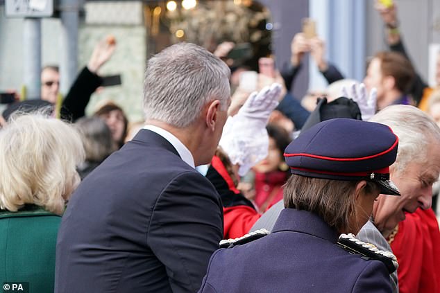 Thelwell (top left) throws eggs at King Charles (right) and the Queen Consort (left) as they arrive for a ceremony at Micklegate Bar