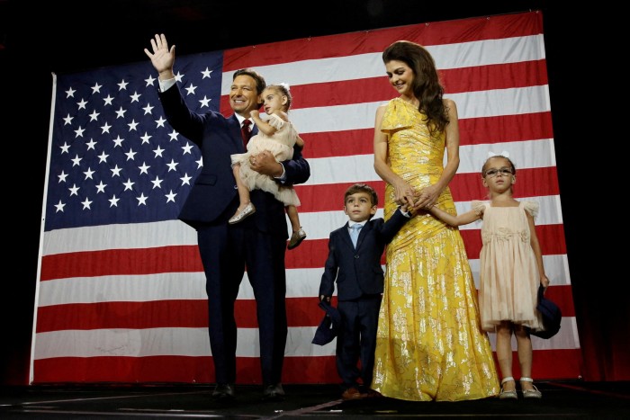 Republican Florida Governor Ron DeSantis waves from stage next to his wife Casey and children during his 2022 U.S. midterm elections night party in Tampa