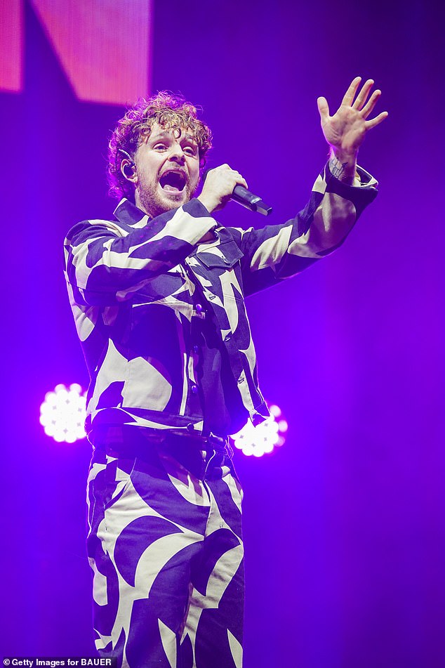 Looking good: The Not Over Yet songster wore his brown locks in a curly short hairdo