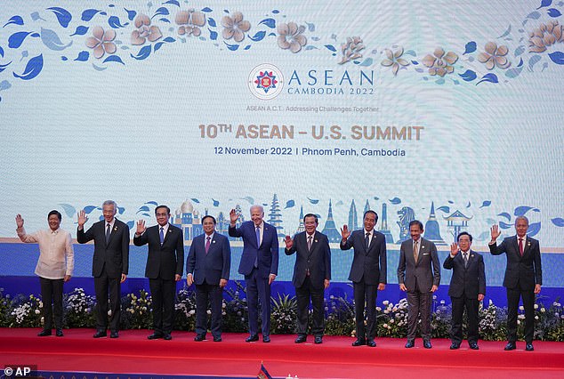 From left, Philippine's President Ferdinand Marcos, Jr., Singapore's Prime Minister Lee Hsien Loong, Thailand's Prime Minister Prayuth Chan-ocha, Vietnam's Prime Minister Pham Minh Chinh, U.S. President Joe Biden, Cambodian Prime Minister Hun Sen, Indonesia's President Joko Widodo, Brunei's Sultan Hassanal Bolkiah, Laos' Prime Minister Phankham Viphavanh, and Malaysian Speaker of the House of Representatives Azhar Azizan Harun wave for a group photo during the ASEAN