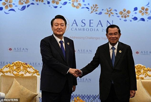 South Korea's President Yoon Suk-yeol is welcomed by Cambodian President Hun Sen, who is hosting the event