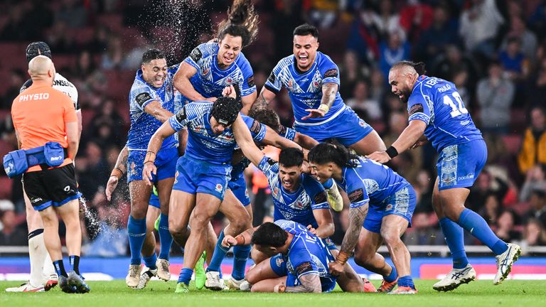 Stephen Crichton is mobbed after landing the winning drop goal for Samoa