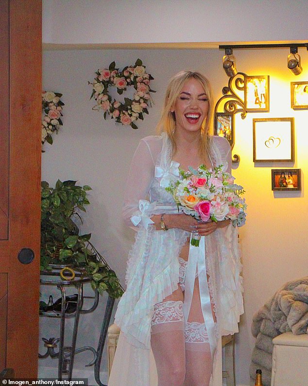 Imogen can be seen smiling ear to ear as she held a bouquet and walked down the aisle